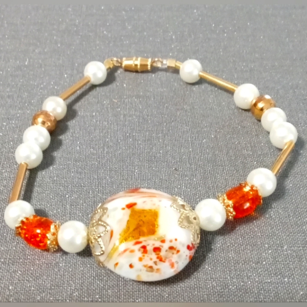 Cute white, orange, and gold bracelet (homemade)